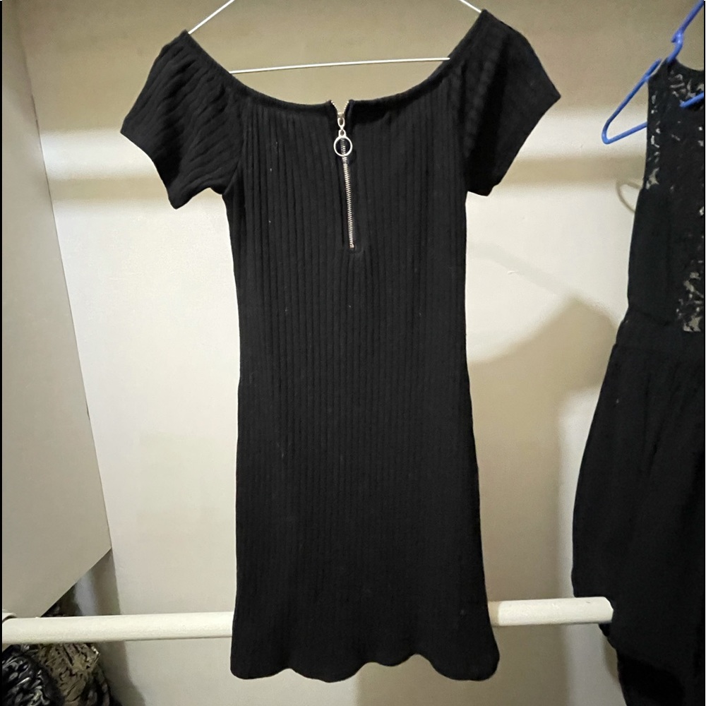 Black zip front stretchy dress.
